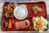 A three item combo from Sushi Miguels Style in San Bernardino featuring teriyaki chicken spicy tuna roll and tuna sashimi  Served with vegetables and a side salad for 1895 on the lunch menu on Sept 15